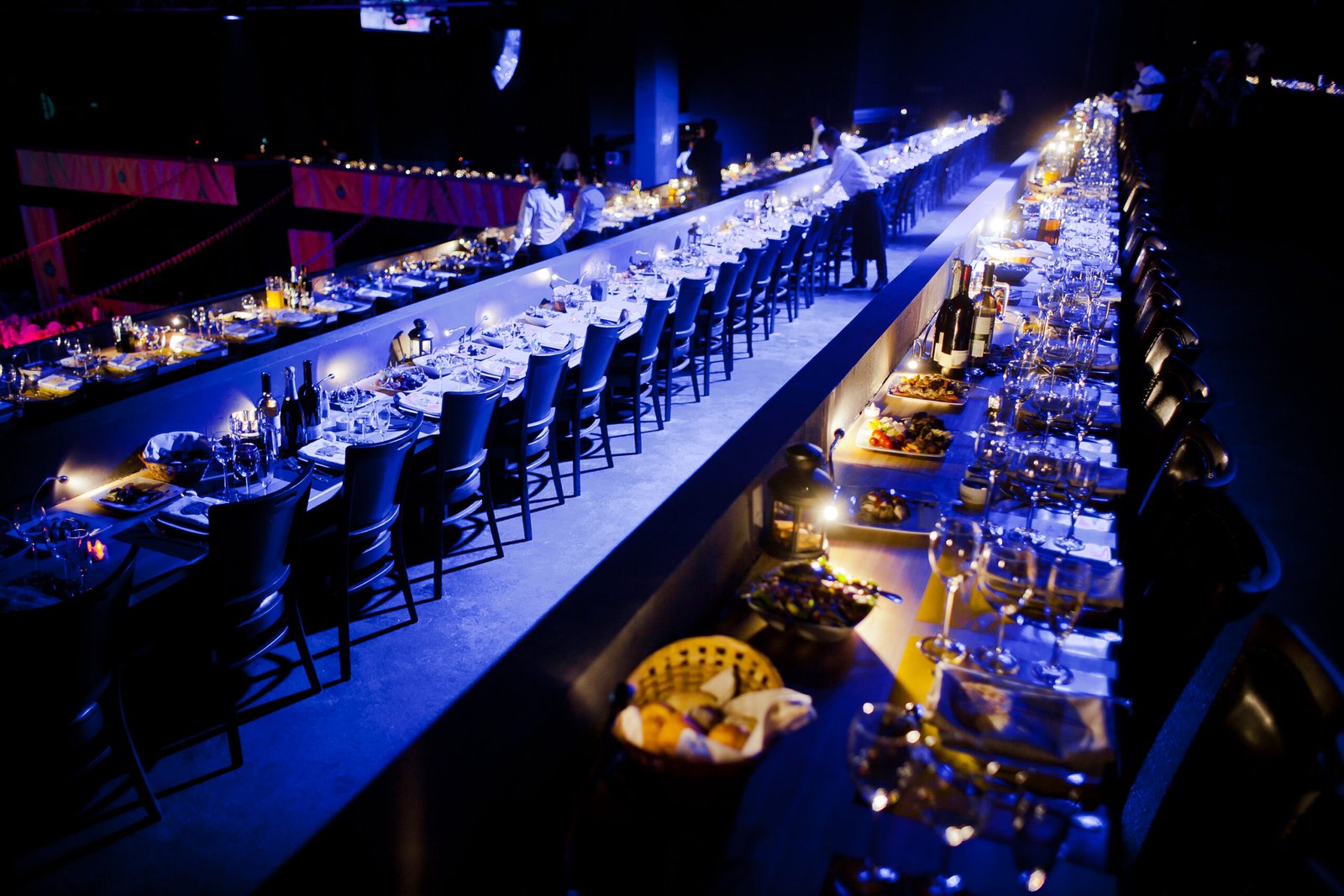 a long table with persony tables and chairs